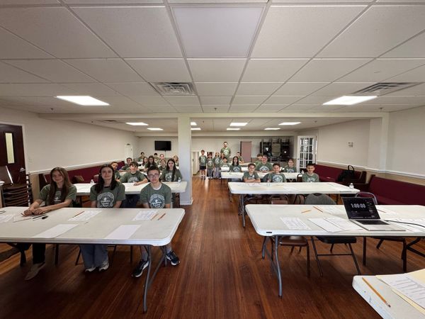 Fellowship hall set up with tables for the Sunday School exam